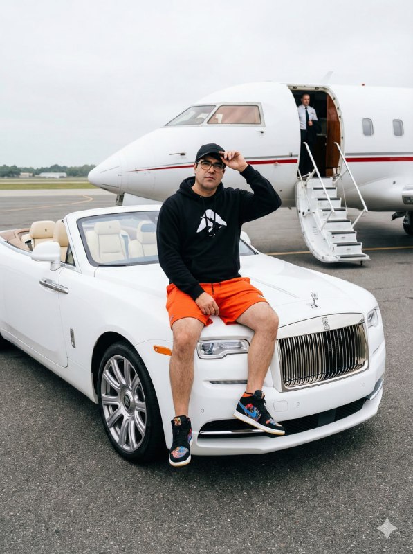 Sitting casually on the hood of the Rolls-Royce Dawn