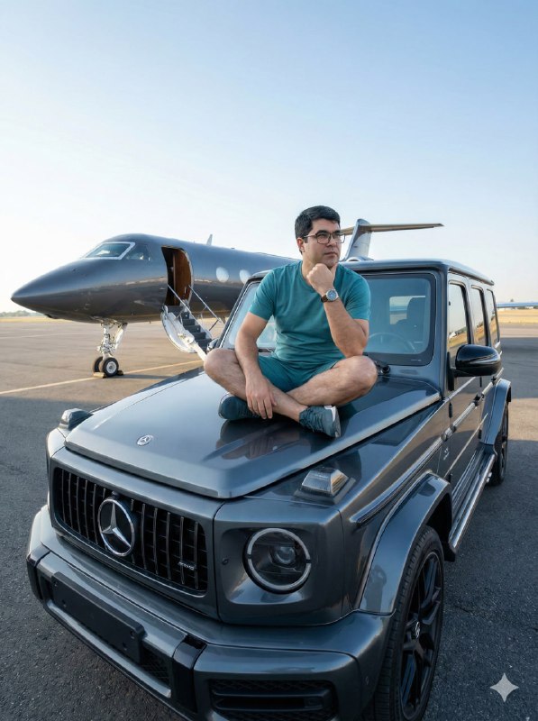 Sitting cross-legged on the hood of the G-Wagen